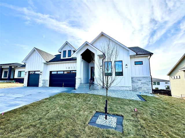 modern farmhouse style home with a garage and a front lawn