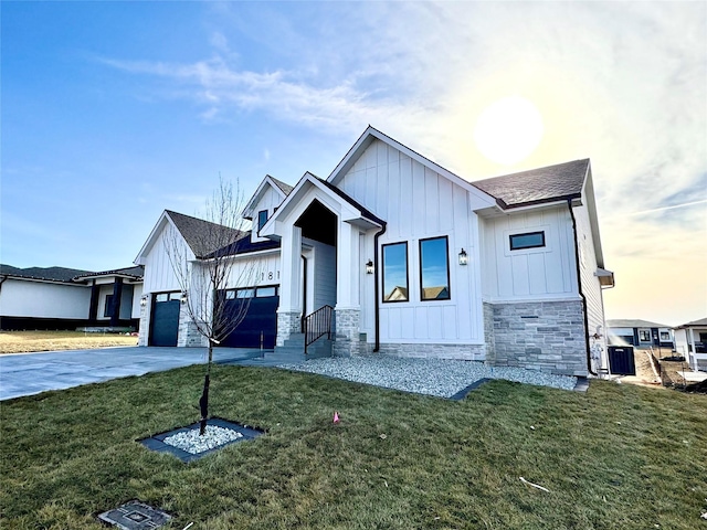 modern farmhouse featuring a garage, central AC unit, and a lawn