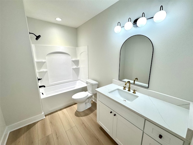 full bathroom featuring hardwood / wood-style flooring, shower / bathtub combination, vanity, and toilet