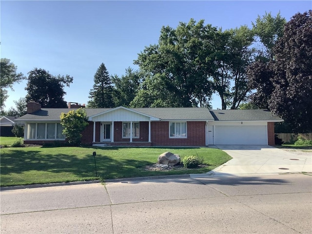 ranch-style house with a garage and a front yard