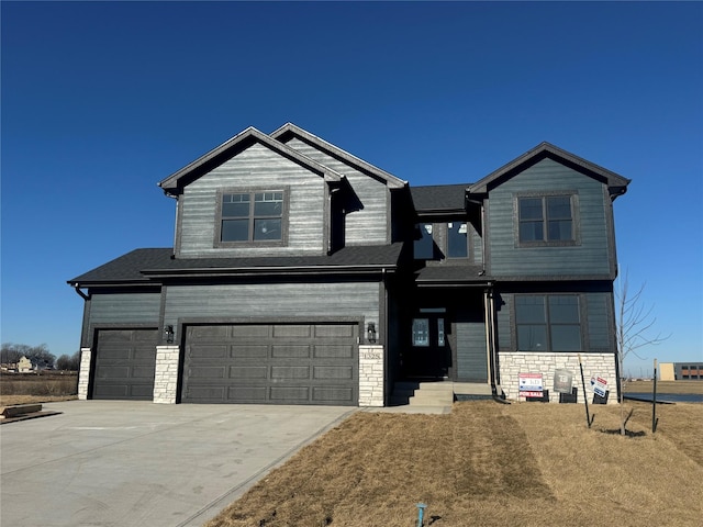 craftsman inspired home with a front yard and a garage