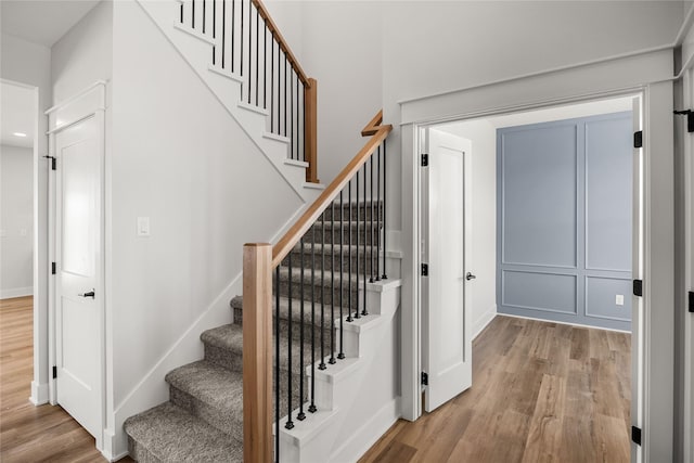 staircase featuring hardwood / wood-style floors