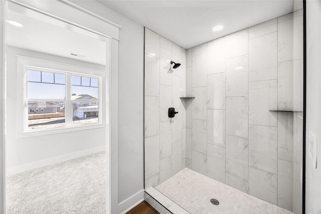 bathroom with tiled shower