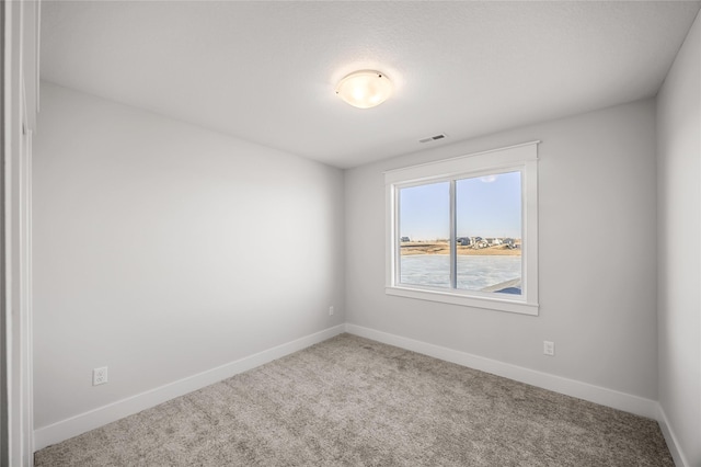 unfurnished room with carpet