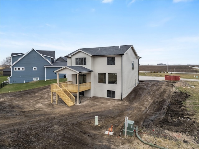 back of property with a wooden deck