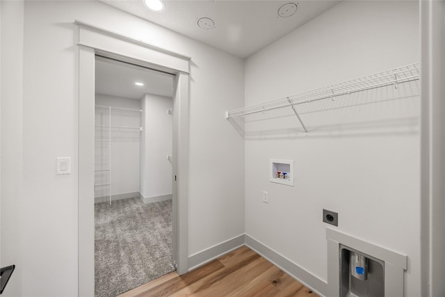 laundry room featuring washer hookup, electric dryer hookup, and hardwood / wood-style floors