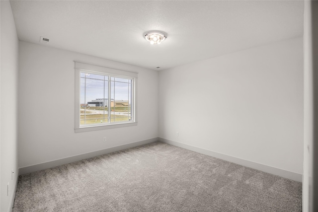 empty room featuring carpet flooring