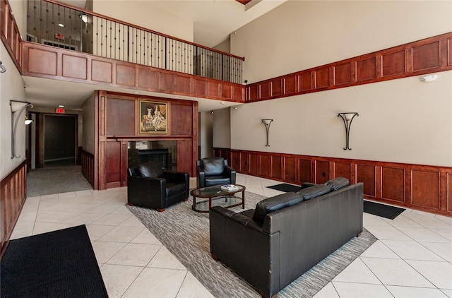 tiled living room with a high ceiling