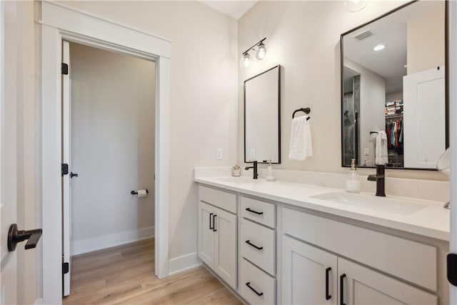 bathroom featuring vanity and wood-type flooring