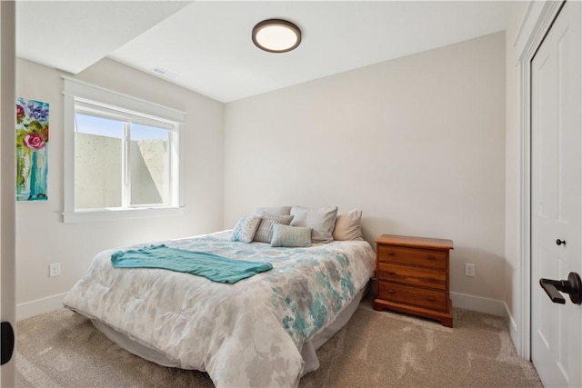 carpeted bedroom featuring a closet