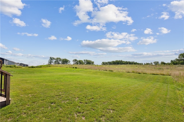 view of yard with a rural view