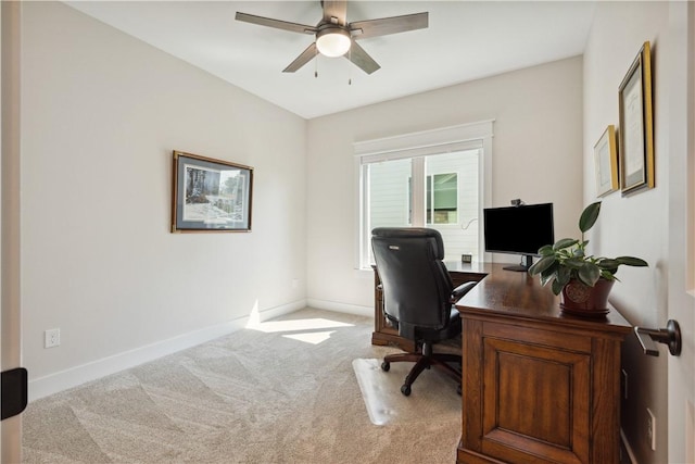 office space with light colored carpet and ceiling fan