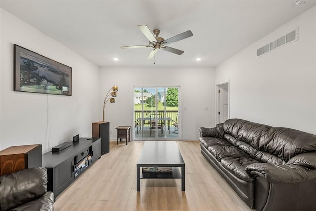 living room with ceiling fan and light wood-type flooring