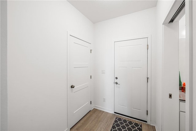 doorway with light hardwood / wood-style floors