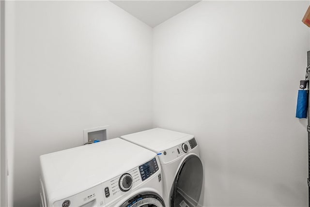 laundry room featuring independent washer and dryer