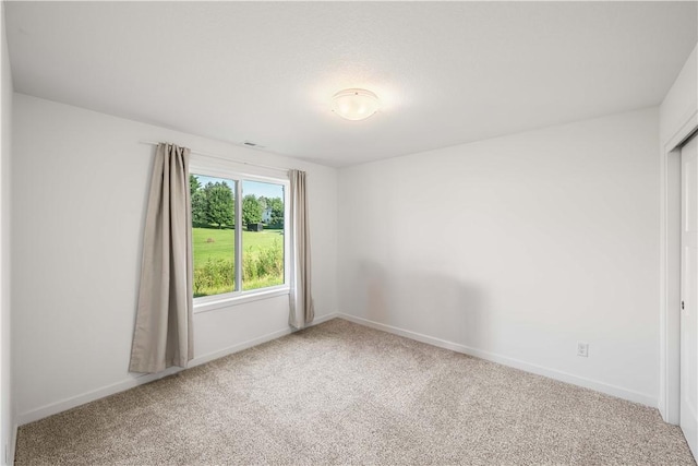 spare room featuring carpet flooring