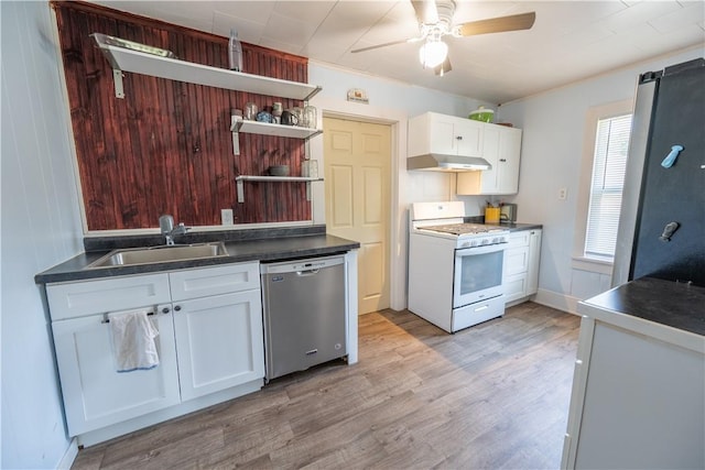 kitchen with sink, white gas stove, white cabinetry, light wood-type flooring, and stainless steel dishwasher