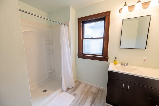 bathroom with vanity, hardwood / wood-style flooring, and a shower with shower curtain