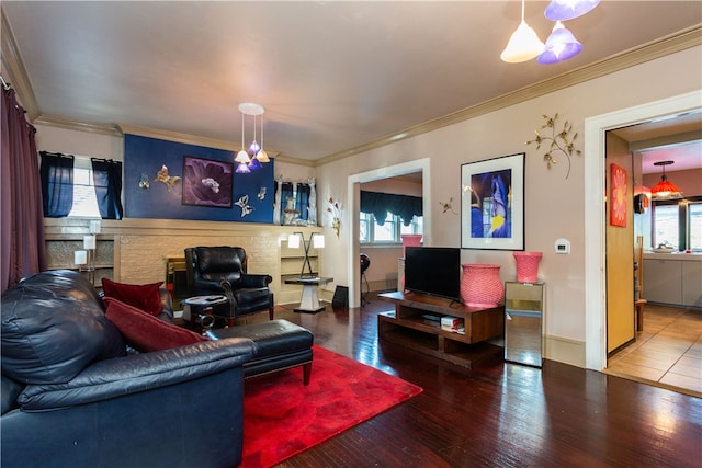 living room featuring ornamental molding and tile patterned floors