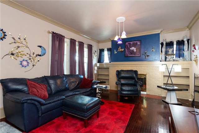 living room with ornamental molding, a brick fireplace, and hardwood / wood-style flooring