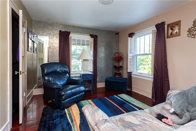 bedroom featuring multiple windows and dark hardwood / wood-style floors