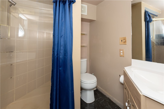 bathroom with vanity, tile patterned flooring, and toilet