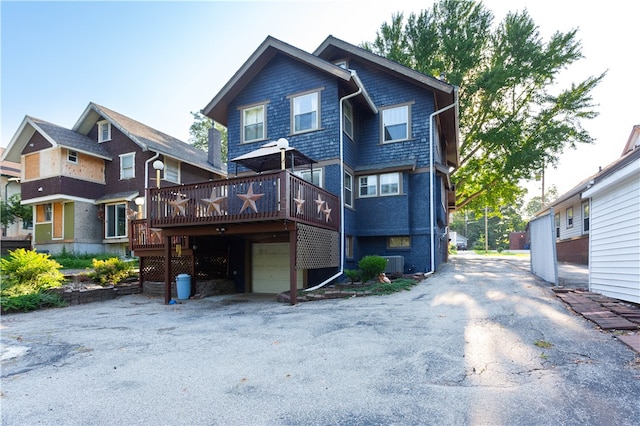 back of property featuring a wooden deck and central air condition unit