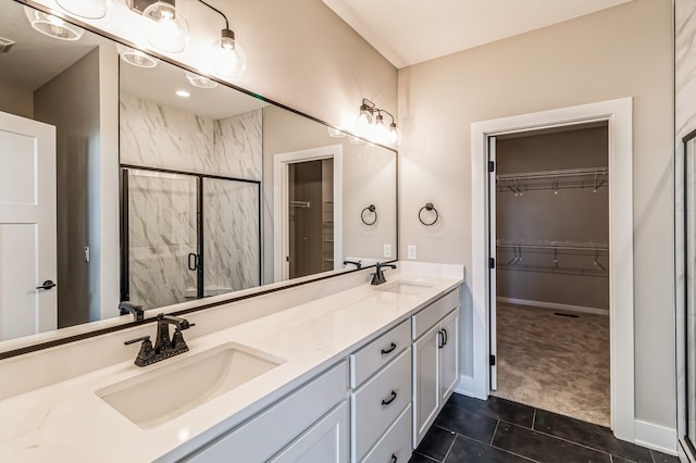 bathroom featuring vanity, an enclosed shower, and tile patterned floors