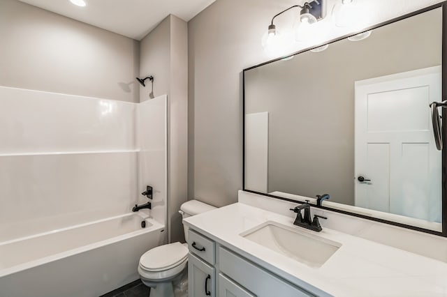 full bathroom featuring vanity, toilet, and  shower combination