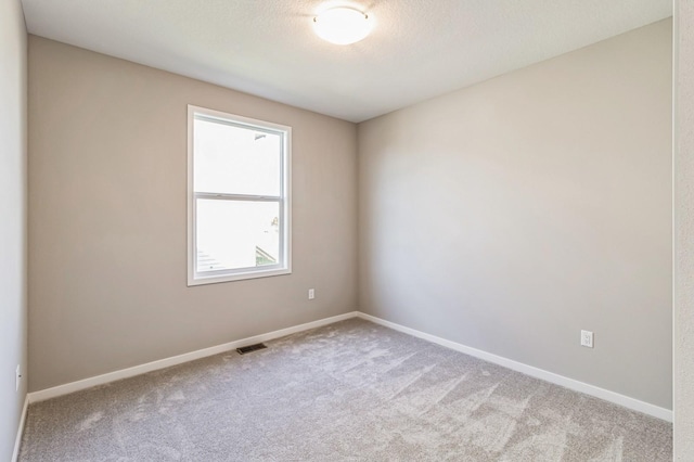406 NE 57th Ct, Ankeny, IA 50021 - empty room with carpet floors, baseboards, and visible vents