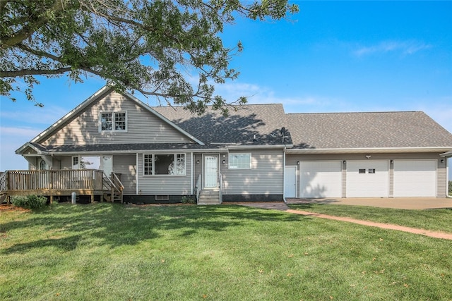 view of front of property with a front lawn and a garage