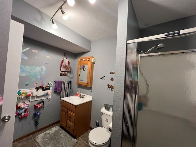 507 E Main St, Le Grand, IA 50142 - bathroom featuring a stall shower, vanity, tile patterned floors, and a textured ceiling