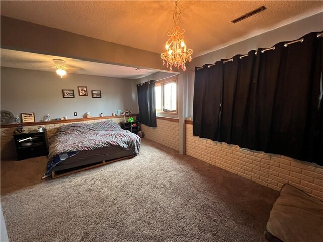 507 E Main St, Le Grand, IA 50142 - carpeted bedroom featuring brick wall and a chandelier