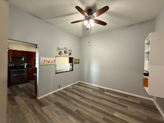 unfurnished room featuring ceiling fan and dark wood-type flooring