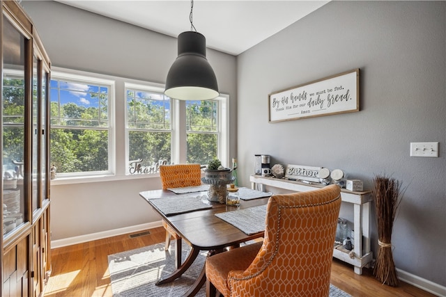 dining room featuring light hardwood / wood-style flooring