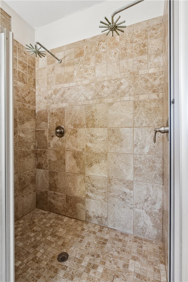 bathroom with tiled shower