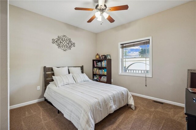 carpeted bedroom featuring ceiling fan