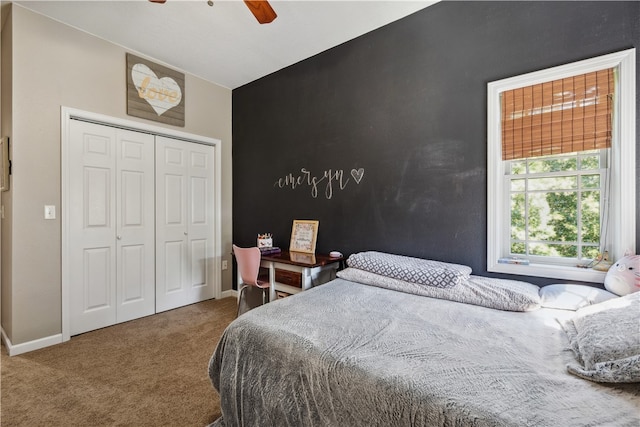 bedroom with a closet, carpet floors, and ceiling fan