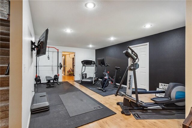 exercise area with hardwood / wood-style flooring