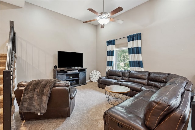 living room featuring light colored carpet, high vaulted ceiling, and ceiling fan