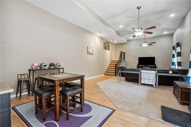 dining space featuring ceiling fan and light hardwood / wood-style flooring