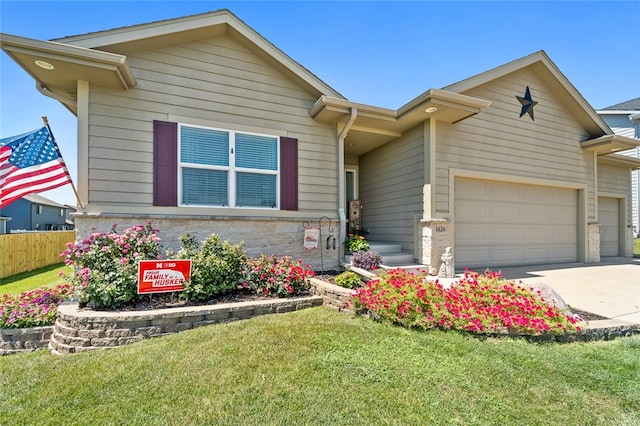 ranch-style home featuring a garage and a front yard