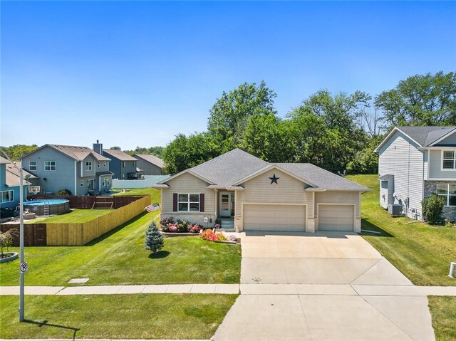 view of front of house featuring a garage and a front yard