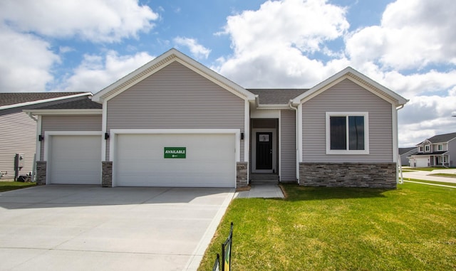 1303 NW Benjamin Dr, Ankeny, IA 50023 - view of front of property featuring concrete driveway, a front lawn, stone siding, and a garage