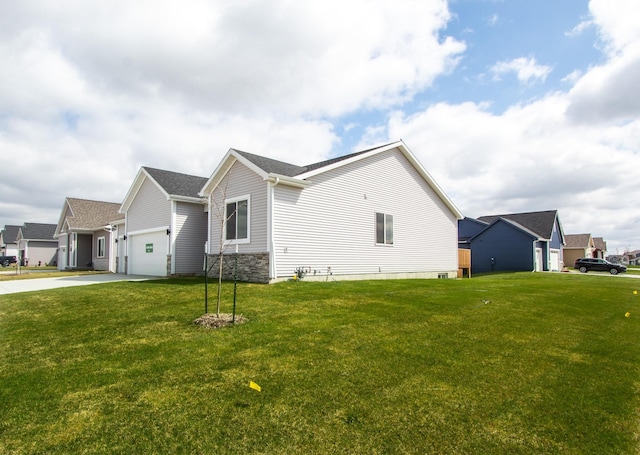 1303 NW Benjamin Dr, Ankeny, IA 50023 - view of side of home with an attached garage, a lawn, and concrete driveway