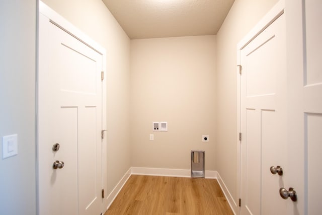 1303 NW Benjamin Dr, Ankeny, IA 50023 - laundry room featuring hookup for an electric dryer, baseboards, light wood-style floors, hookup for a washing machine, and laundry area