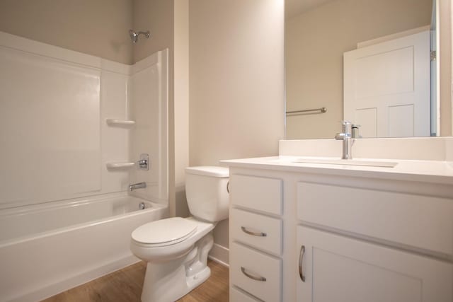 1303 NW Benjamin Dr, Ankeny, IA 50023 - bathroom featuring toilet, bathtub / shower combination, vanity, and wood finished floors