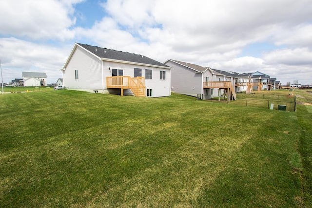 1303 NW Benjamin Dr, Ankeny, IA 50023 - rear view of property featuring a yard, stairway, fence, and a deck