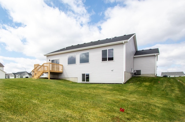 1303 NW Benjamin Dr, Ankeny, IA 50023 - rear view of property with a lawn, central AC unit, stairway, and a deck