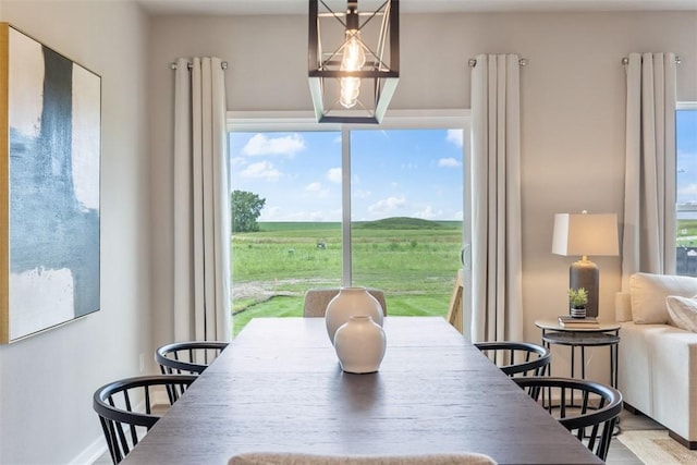 dining area featuring a notable chandelier